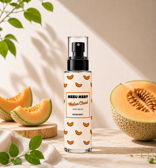 A clear spray bottle labeled 'MIZU MIST Melon Cloud' stands on a light stone surface, surrounded by melon slices and green leaves. The bottle has a white label with orange melon slice illustrations and a black pump.